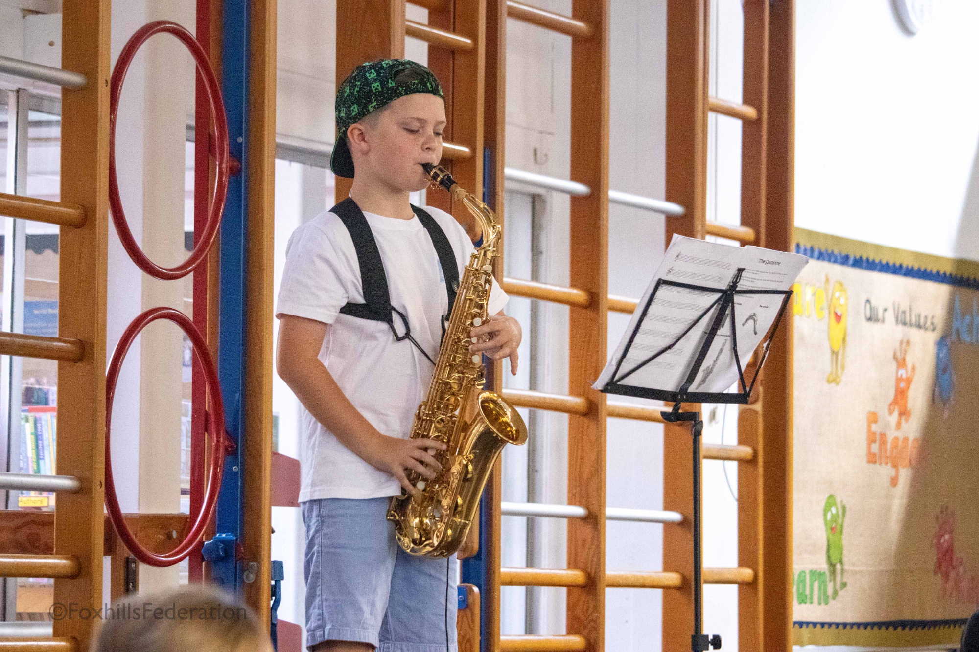 A boy plays the saxophone at Foxhills Got Talent
