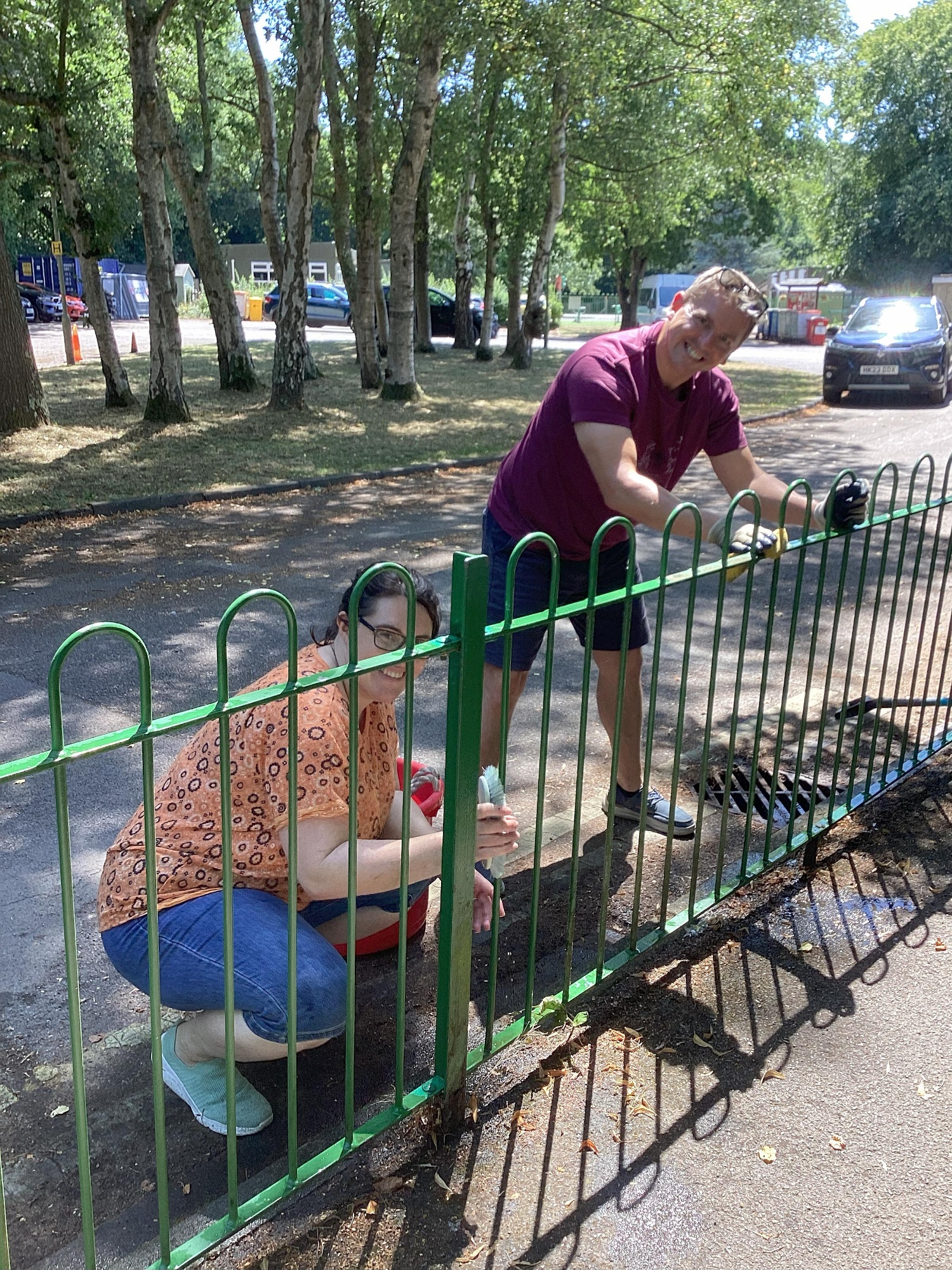 Miss Kynaston cleans the school fence