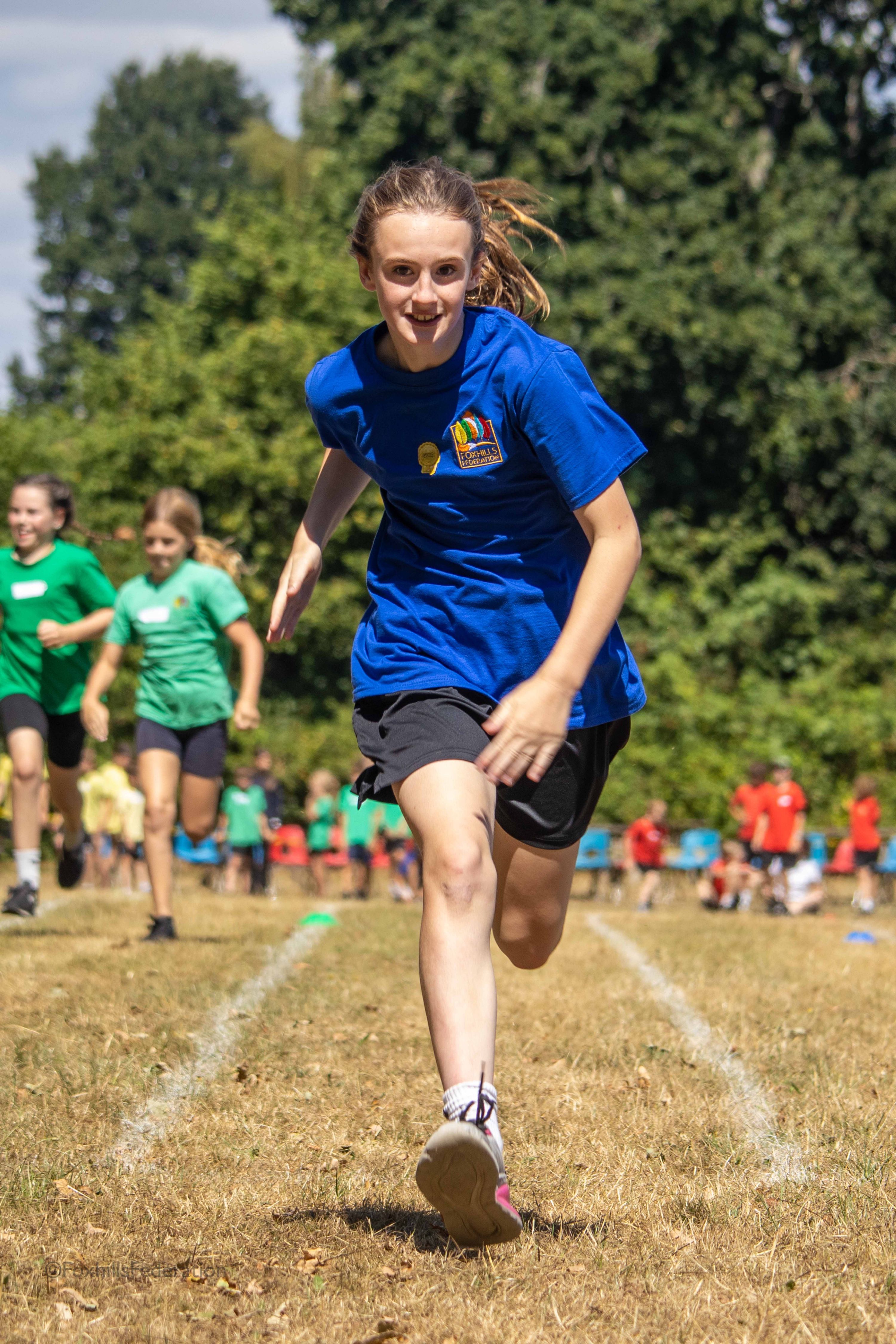 Children run a running race