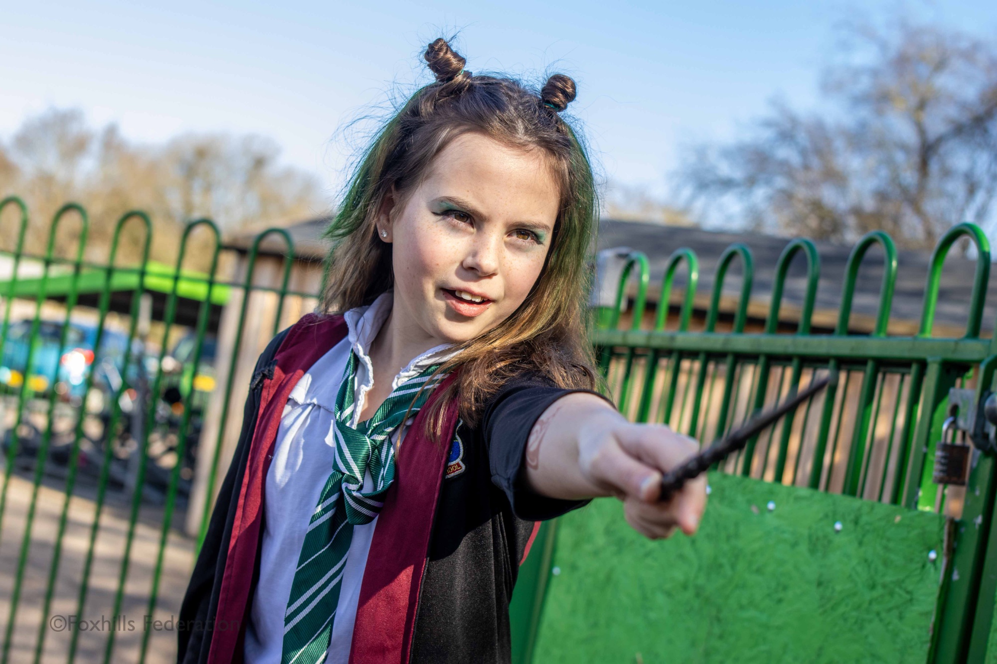 A girl is dressed as Harry Potter