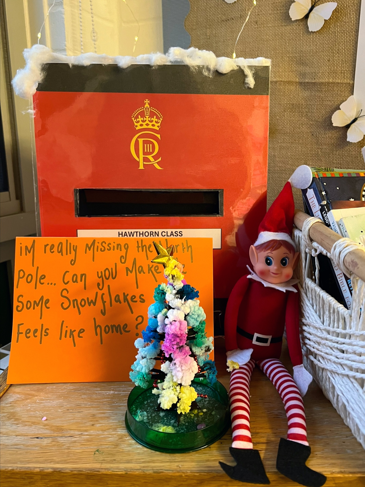 An elf next to a postbox.