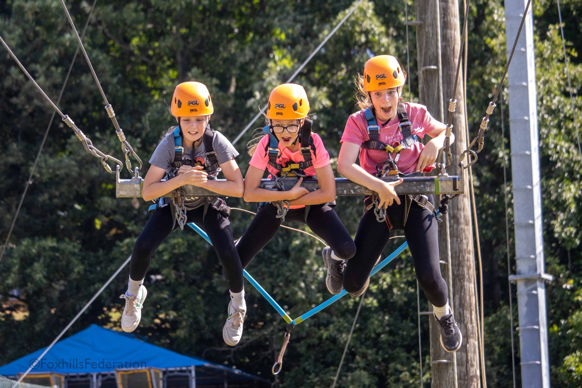 Children scream on the giant swing